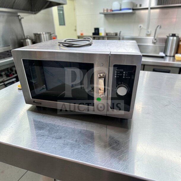Amana RMS10DSA commercial microwave, 1000W, dial controls, stainless steel, 120V, in exceptional condition on a kitchen counter.