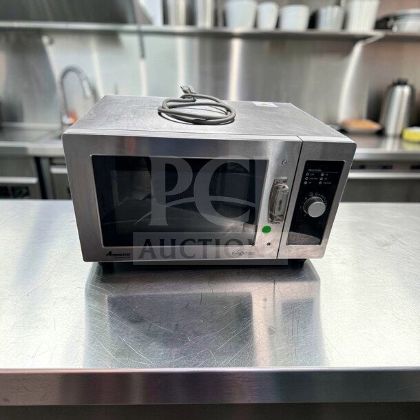 Amana RMS10DSA commercial microwave oven, 1000W, stainless steel, dial controls, excellent condition, 120V.