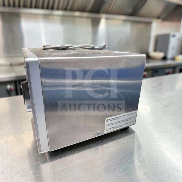 Amana RMS10DSA commercial microwave oven, stainless steel, 1000W, dial controls, exceptional condition, 120V, side view.
