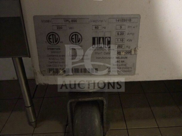JAC Varia Pro VPL 800 bread slicer label showing model, voltage (230V), 3 phase, 5.20 amp, 1.10 KW, 252 kg, manufactured in Belgium.