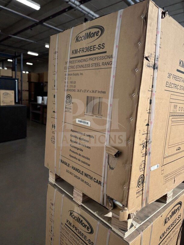 Brand new KoolMore KM-FR36EE-SS 36" electric range in original box with visible scratches and dents. Model details on box.
