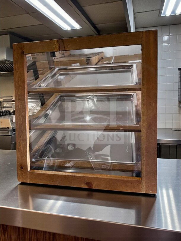 Wooden countertop pastry display case, 2-tier design with glass front, in remarkable condition. Fully tested and operational.