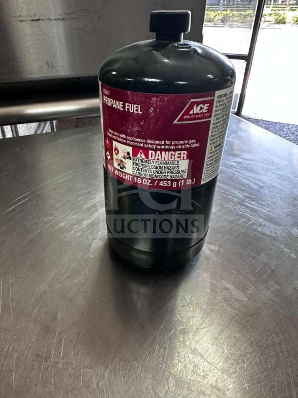 Ace Hardware 16 oz steel propane fuel cylinder in exceptional condition. Includes clear safety labels, model ACE-S-PROP-1007.