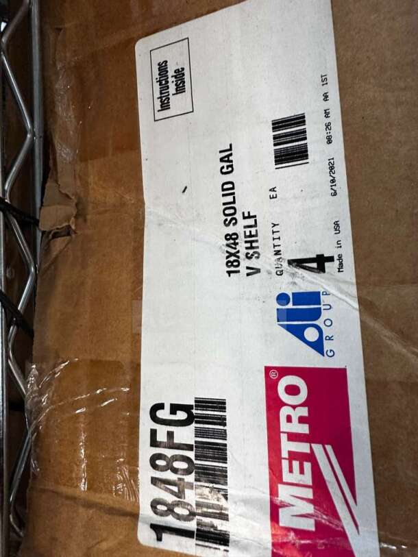 Metro 1848FG 18"x48" solid galvanized shelf in box, NSF listed, commercial storage, fully tested. Labels visible.