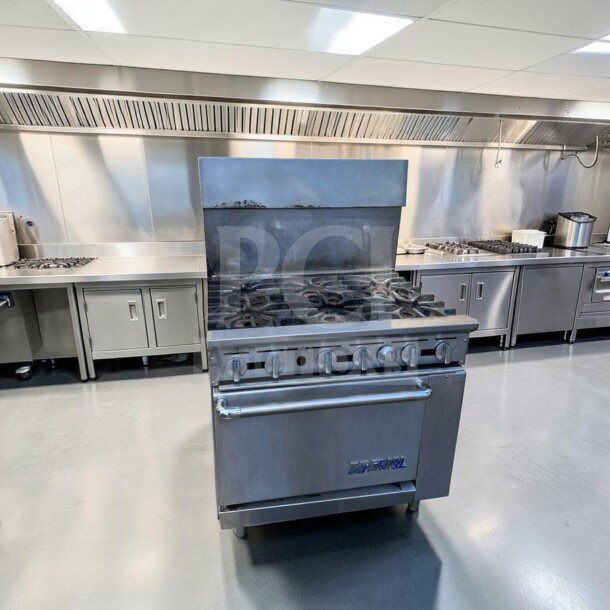 Imperial IR-6 36" commercial gas range with 6 burners, oven, and natural gas operation. In exceptional condition.