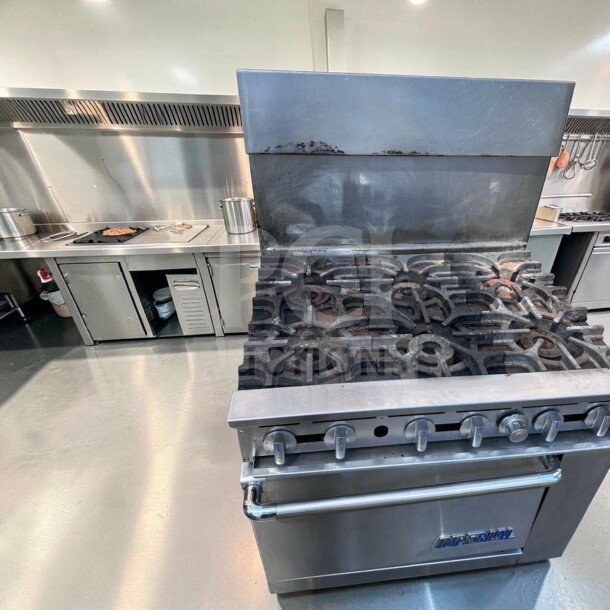 Imperial IR-6 36" commercial gas range with 6 burners and oven, natural gas, excellent condition, fully tested, heavy-duty.