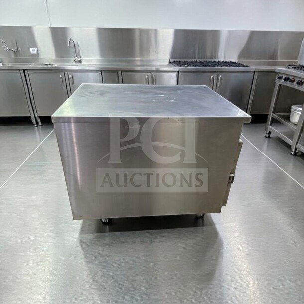 Superior condition FWE HLC-1826-4(A) commercial countertop heated holding cabinet, 4 pan capacity, stainless steel finish.