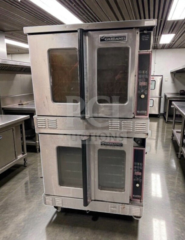 Two Garland Master 450 gas convection ovens, stainless steel, full-size, single deck, excellent condition, fully operational.