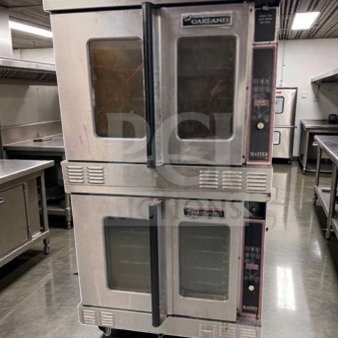 Two Garland Master 450 gas convection ovens, stainless steel, full-size, single deck, excellent condition, fully operational.