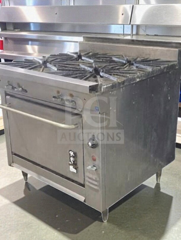 Montague 136-5A Legend 36" gas range, four 18" burners, standard oven, 160,000 BTU, NSF/cETLus listed, excellent condition.