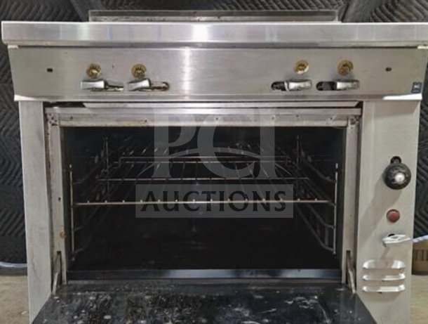 Remarkable Condition Montague 136-5A Legend 36" gas range with four 18" burners, standard oven base, fully operational.