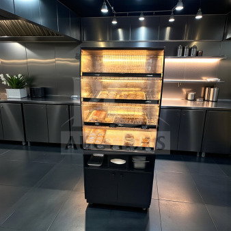 Illuminated black non-refrigerated bakery display case, immaculate condition, 3 levels, fully operational, unbranded.