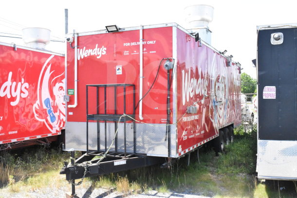 2022 Rock Solid Cargo 8.5x28 food trailer with *Wendy's* branding, VIN 7H2BE2831ND043576, featuring delivery service logos.
