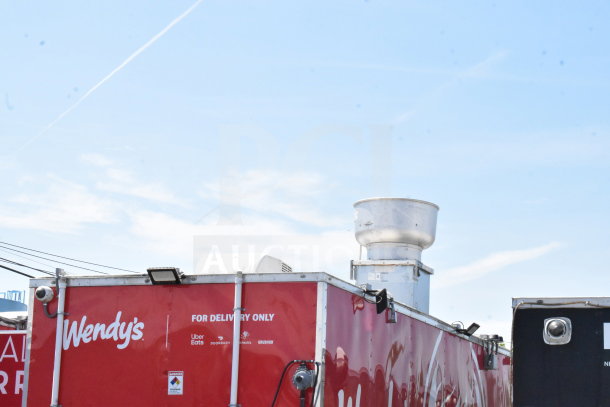 2022 Rock Solid Cargo 8.5x28 food trailer, red with branding for delivery services, well-maintained condition.