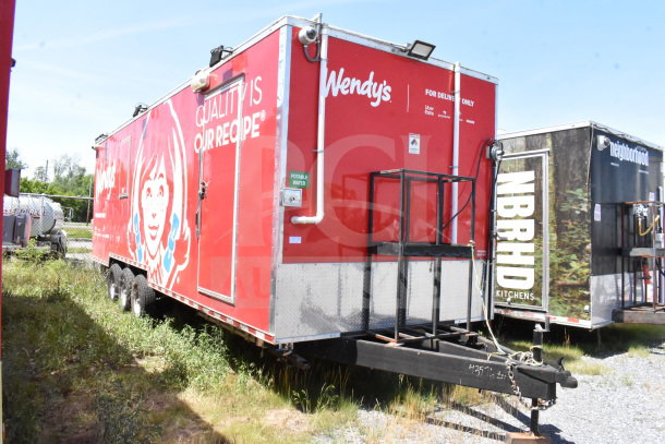 2022 Rock Solid Cargo 8.5x28 food trailer, red, Wendy's branding, dual axle, visible VIN 7H2BE2831ND043576, good condition.