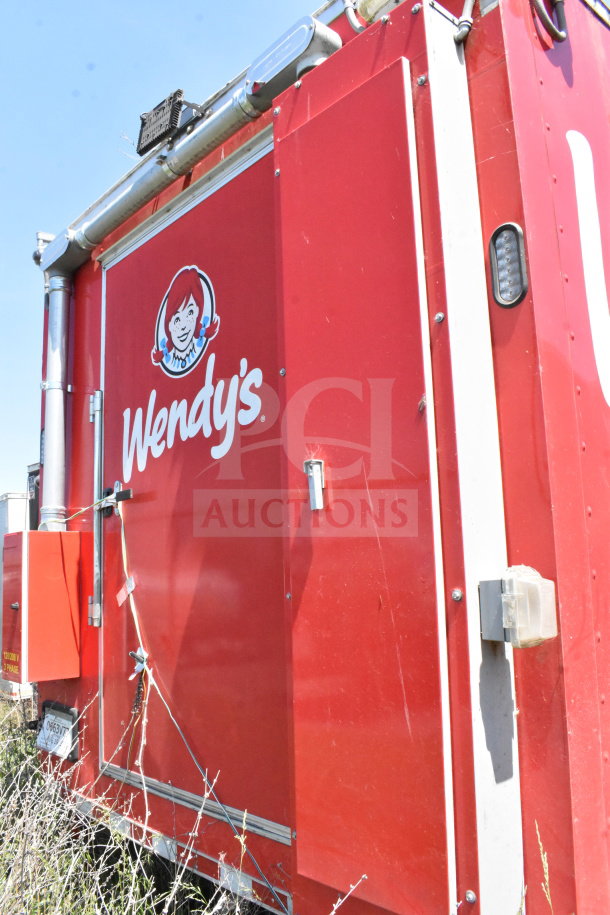 2022 Rock Solid Cargo 8.5x28 food trailer, red exterior with Wendy's branding, visible wear. VIN: 7H2BE2831ND043576.
