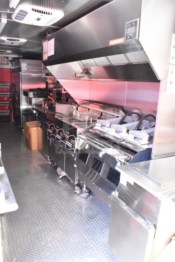 2022 Rock Solid Cargo 8.5x28 food trailer interior with commercial kitchen setup; VIN 7H2BE2831ND043576 visible.