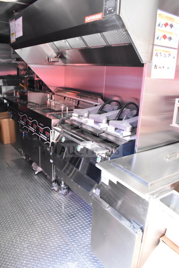 2022 Rock Solid Cargo 8.5x28 food trailer with stainless steel kitchen setup, CaptiveAire hood, excellent condition.