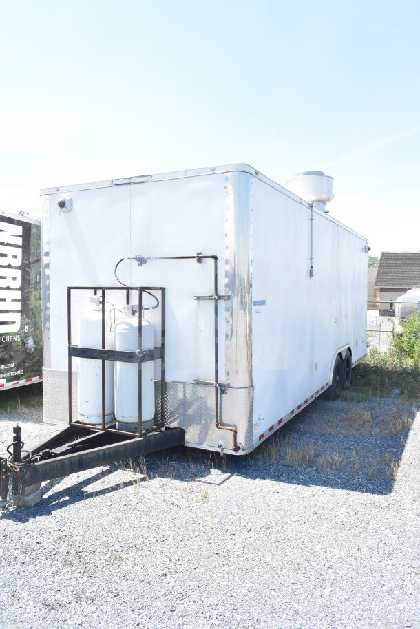 Diamond Cargo 8.5'x24' food trailer in white, VIN 53NBE2429M1089847, featuring dual propane tanks and roof vent.