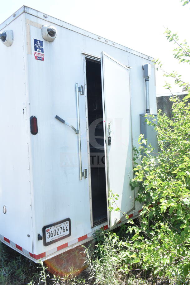 Diamond Cargo 8.5'x24' food trailer, white exterior, open rear door, Maryland plate visible, VIN 53NBE2429M1089847.
