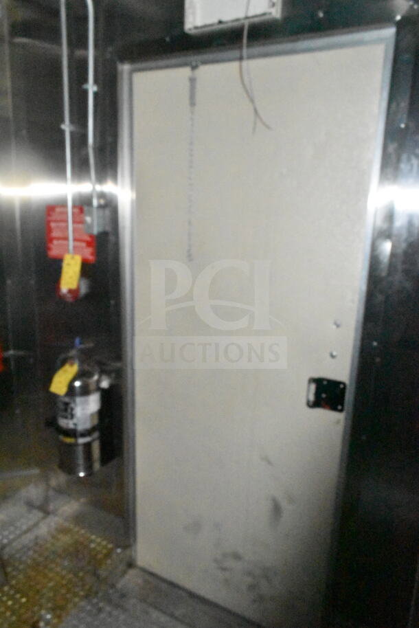 Diamond Cargo 8.5'x24' food trailer interior with fire extinguisher. Details show electrical wiring and a sealed door.