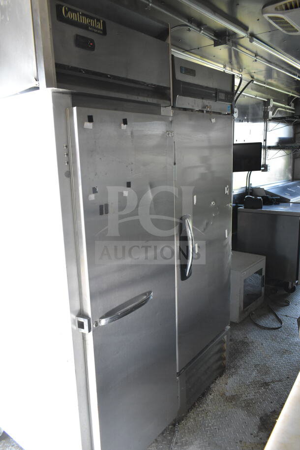 Interior of Diamond Cargo 8.5'x24' food trailer with Continental Refrigerator, stainless steel, and workspace.