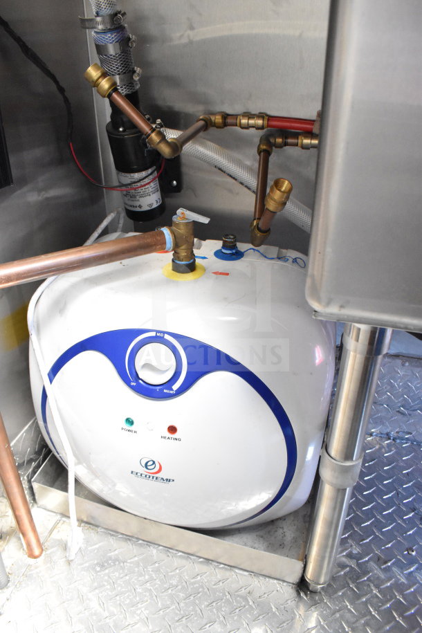 Eccotemp water heater mounted in the 2022 Rock Solid Cargo 8.5x28 Wendy's food trailer, featuring copper piping.