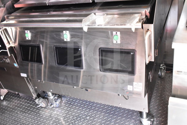 2022 Rock Solid Cargo 8.5x28 food trailer interior with Garland Clamshell grill, control panels, and stainless steel surfaces.