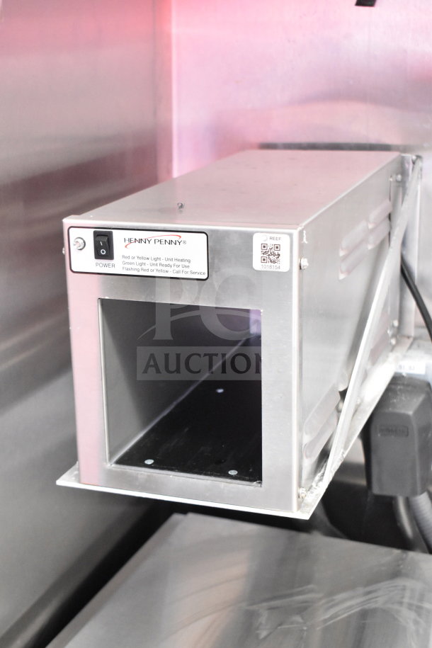 Henny Penny component in 2022 Rock Solid Cargo food trailer, power switch visible, metal casing, part of refrigeration suite.