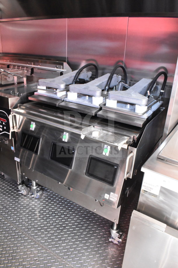 2022 Rock Solid Cargo 8.5x28 food trailer interior featuring Garland Clamshell, Henny Penny Fryer, and CaptiveAire grease hood.