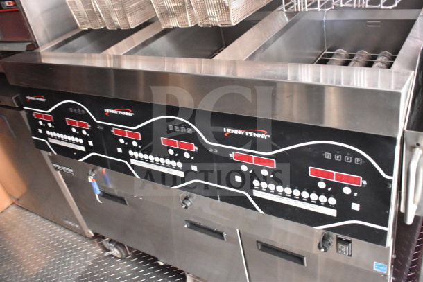 2022 Rock Solid Cargo 8.5x28 food trailer with Henny Penny fryer, CaptiveAire grease hood, Garland clamshell, and refrigeration suite.