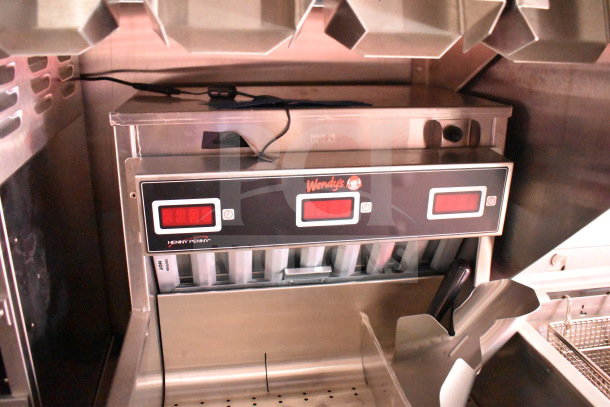 2022 Rock Solid Cargo 8.5x28 Wendy's food trailer interior with Henny Penny fryer and Wendy's control panel.