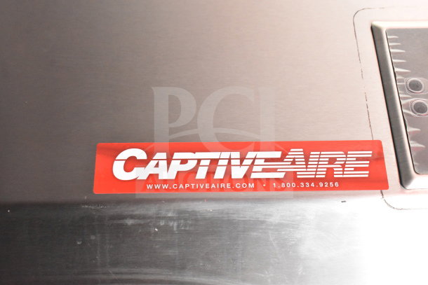 CaptiveAire grease hood label on a stainless surface with contact information.