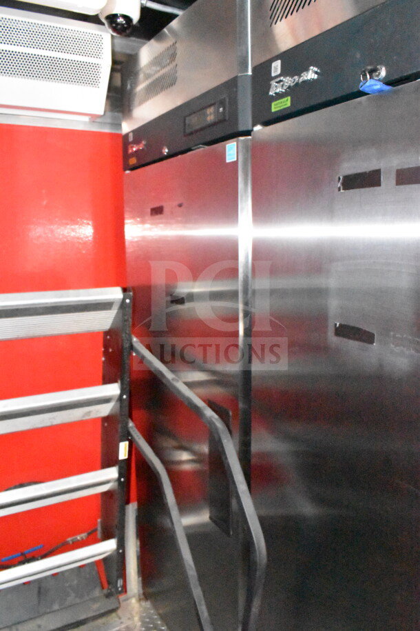 2022 Rock Solid Cargo 8.5x28 Wendy's food trailer interior with stainless steel CaptiveAire grease hood and refrigeration suite.
