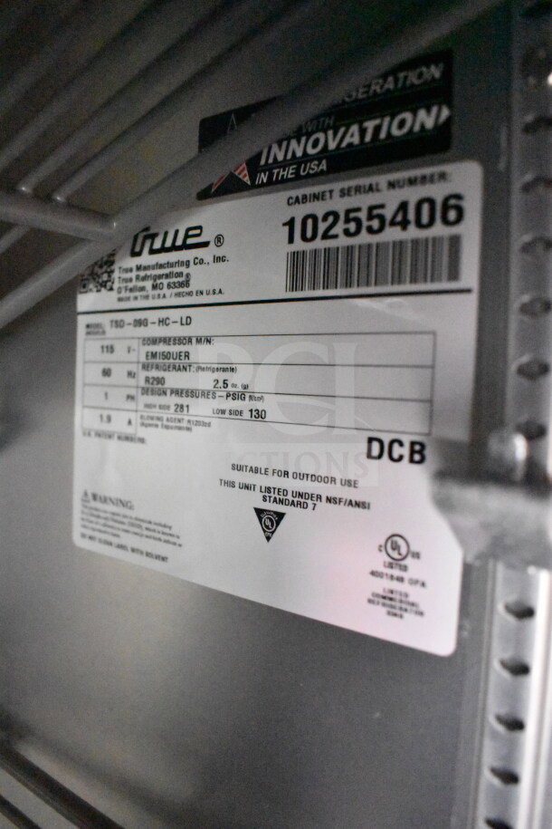 Label on True Refrigeration model TSD-09G indicates it's suitable for outdoor use, NSF/ANSI Standard 7 compliant.