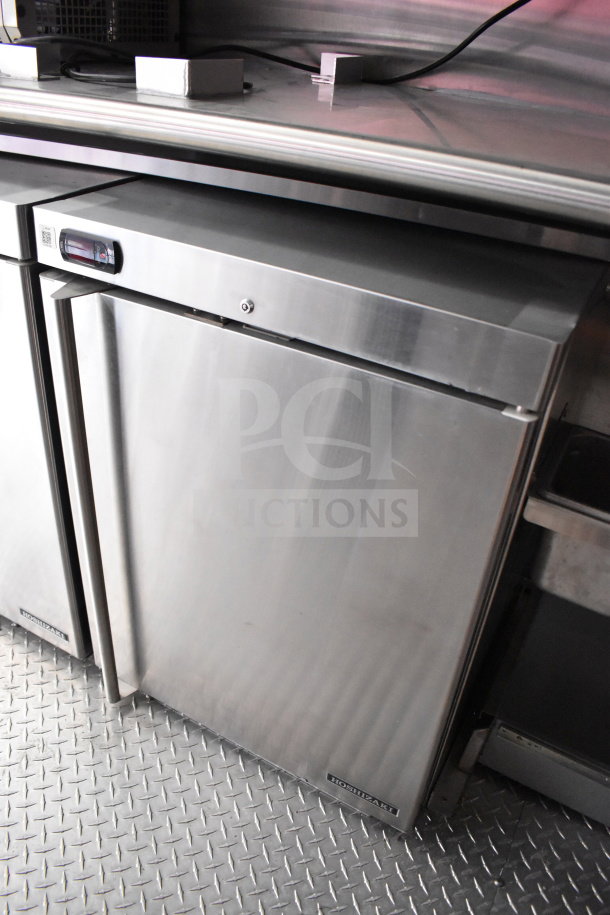 2022 Rock Solid Cargo food trailer with Hoshizaki refrigeration unit on diamond plate flooring, stainless steel exterior.