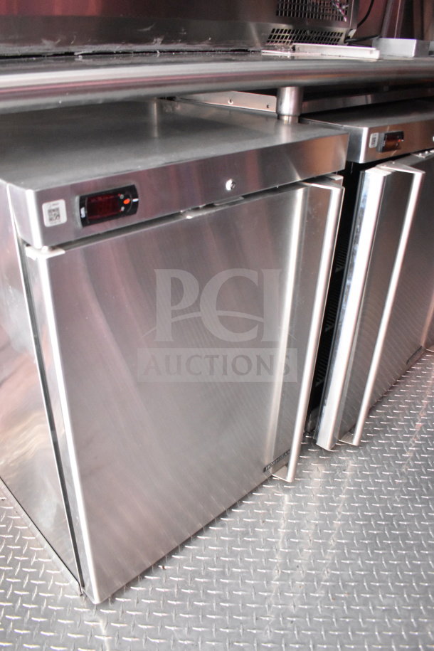 Stainless steel refrigeration units inside a 2022 Rock Solid Cargo 8.5x28 Wendy's Food Trailer.