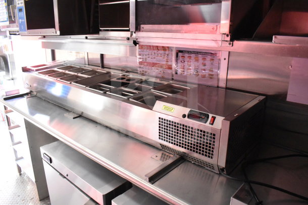 2022 Rock Solid Cargo 8.5x28 food trailer interior with commercial refrigeration suite, showing stainless steel prep station.