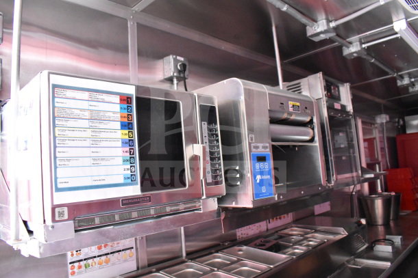 2022 Rock Solid Cargo 8.5x28 food trailer interior with CaptiveAire grease hood, Antunes toaster, and Menumaster microwave.