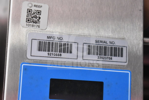 Label detail of 2022 Rock Solid Cargo food trailer, showing QR code, MFG No: 9210888, and Serial No: 22023708.