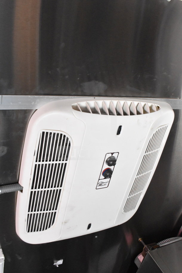 2022 Rock Solid Cargo 8.5x28 food trailer interior; features overhead ventilation system with control knobs.