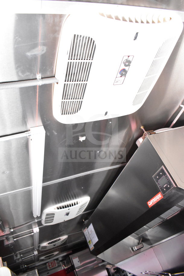 2022 Rock Solid Cargo 8.5x28 food trailer interior with CaptiveAire grease hood, ceiling vents, and stainless steel surfaces.