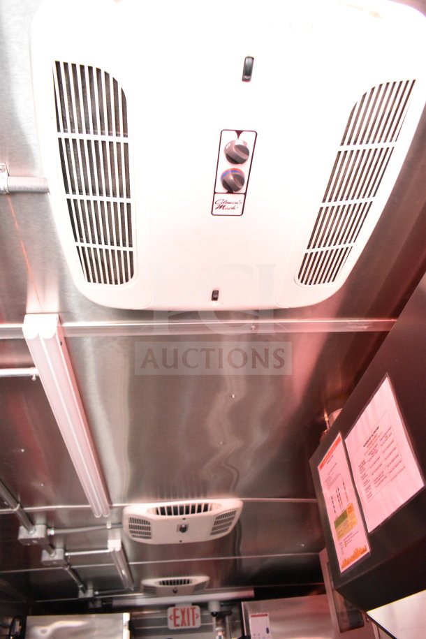 2022 Rock Solid Cargo 8.5x28 food trailer interior, featuring climate control units and a CaptiveAire grease hood.