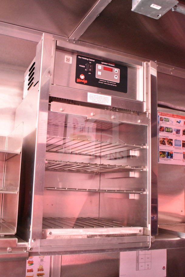 Rock Solid Cargo 2022 Wendy's food trailer, featuring Henny Penny bun holding cabinet with visible Wendy's branding and control panel.