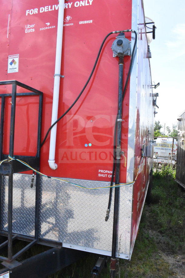 2022 Rock Solid Cargo 8.5x28 Wendy's food trailer, red exterior, visible propane shut-off, logos for delivery services.