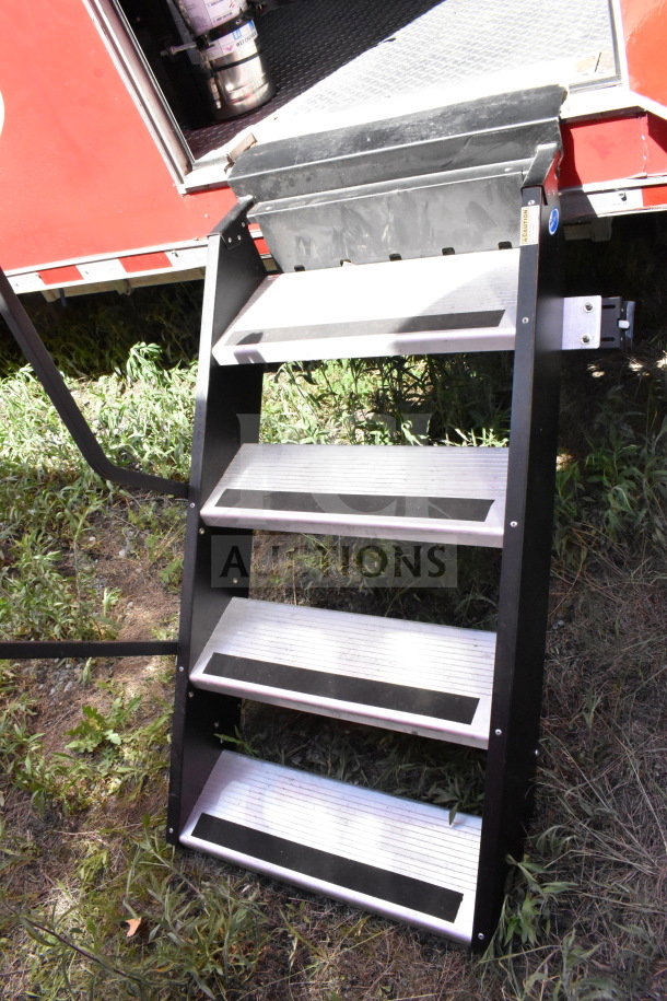 2022 Rock Solid Cargo food trailer entrance steps, sturdy black metal with four non-slip aluminum steps.