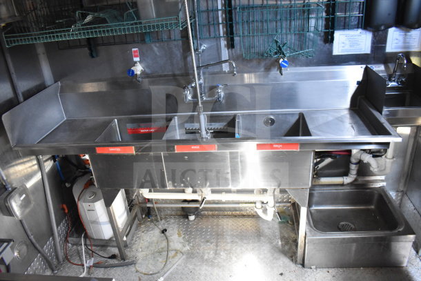 Titanium Cargo Trailers kitchen sink setup in Wendy's food trailer. Features sanitize, rinse, and wash stations. Stainless steel construction.