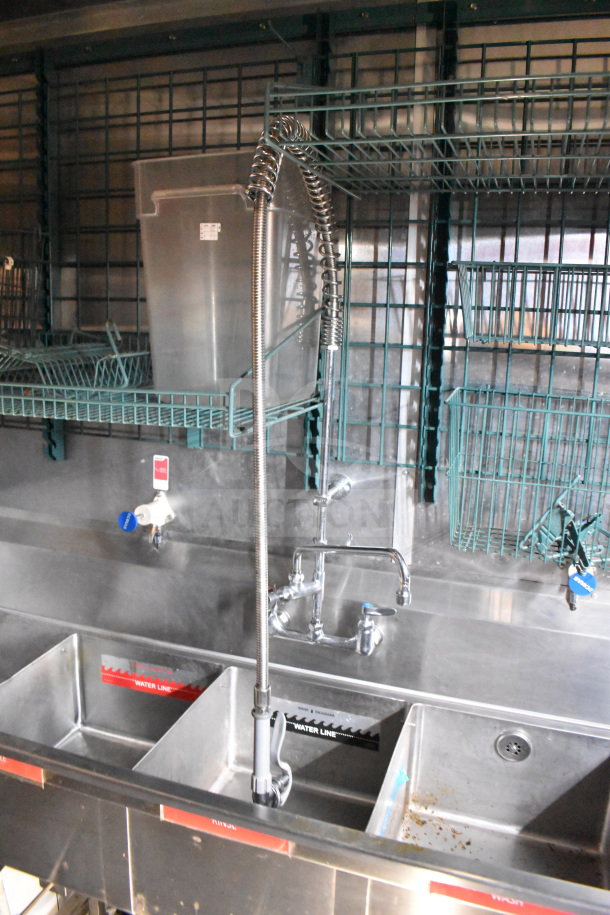 Titanium Cargo Trailers food trailer sink with three compartments, faucet, and wire shelving. Includes water line indicators.