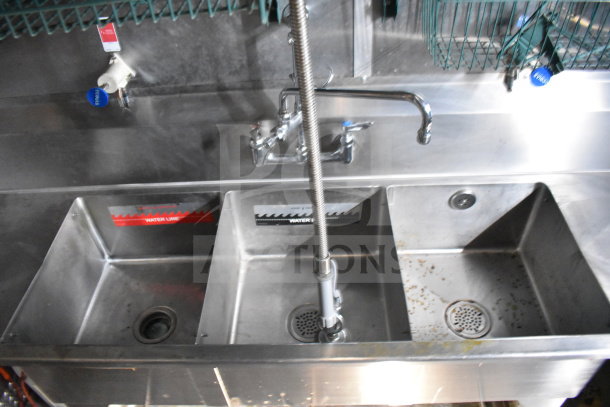 Three-compartment sink in Titanium Cargo Trailers 8.5'x28' food trailer, featuring clearly marked water lines and stainless steel construction.