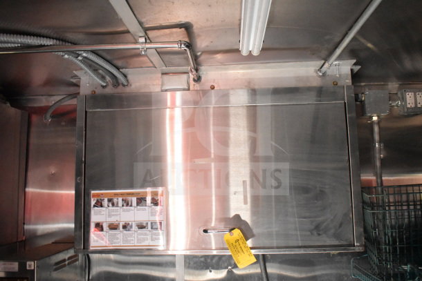Titanium Cargo Trailers 8.5'x28' interior with CaptiveAire grease hood. Includes Wendy’s preparation instructions and a tag.
